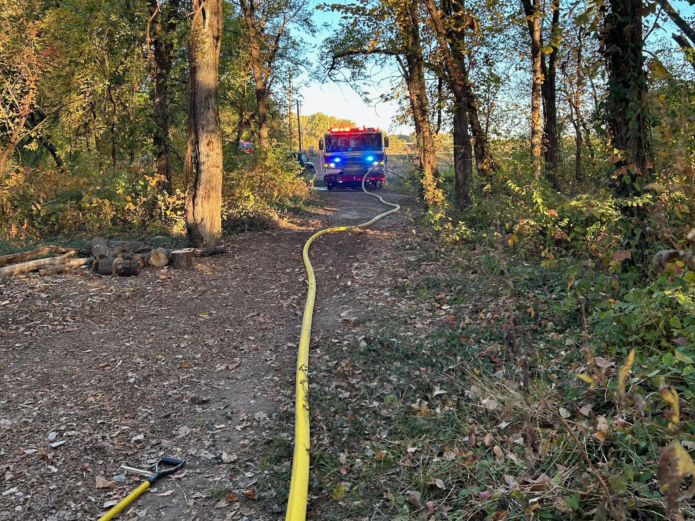 Firefighters respond to fire at secluded riverside camp caused by